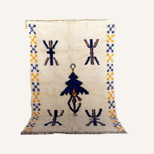 Full view of Azilal Moroccan rug with golden star motif and green Amazigh borders (150 × 250 cm).
