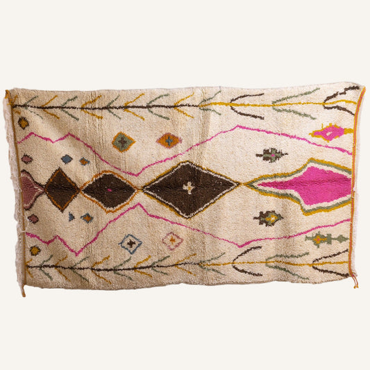 Full view of Azilal Moroccan rug with pink and brown diamond medallions on ivory field (150 × 260 cm)